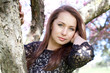Beautiful young woman in spring garden