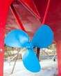 blue sailboat propeller in a red hull