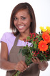 Young florist with a bunch of flowers