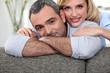 couple leaning on a sofa