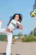 Woman playing volleyball on beach Woman playing volleyball on beach
