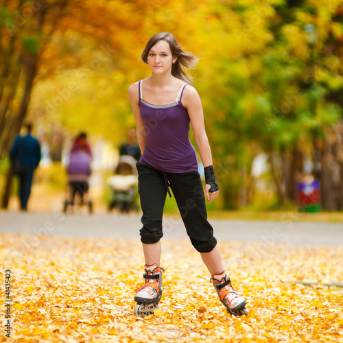 Photo: Woman on roller skates in the park Woman on roller skates in the park