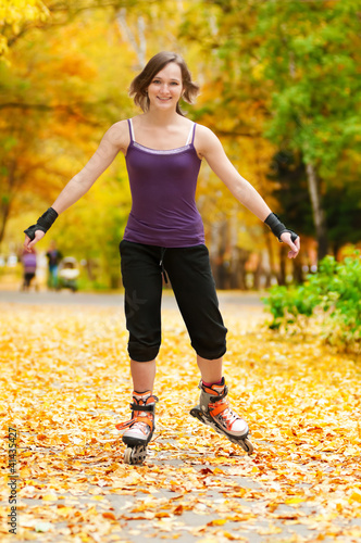 Photo: Woman on roller skates in the park Woman on roller skates in the park