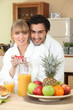 Couple having breakfast in your bathrobe