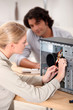 a female technician repairing a computer