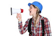 Woman laborer screaming in a bullhorn