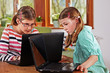 Foto: two teenage girls with laptops two teenage girls with laptops