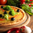 Pizza with ham, pepper and olives Pizza with ham, pepper and olives