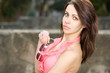 Fashionable young brunette posing outdoors.