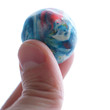 Planet in fingers isolated