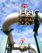 Industrial zone, Steel pipelines and valves against blue sky