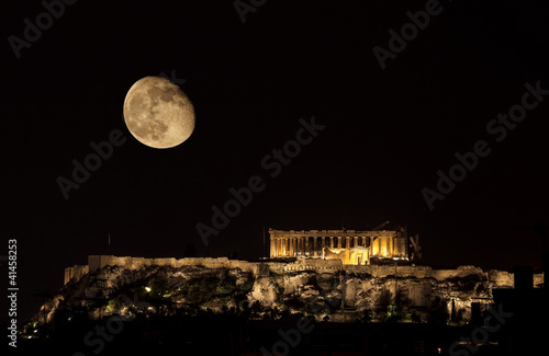 Photo: Parthenon on Acropolis Hill of Athens by night with moon Parthenon on Acropolis Hill of Athens by night with moon
