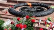 Flowers Lay Near Eternal Fire