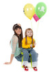 studio shot of mother and daughter with balloons