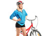 Female biker with helmet posing next to a bike Female biker with helmet posing next to a bike