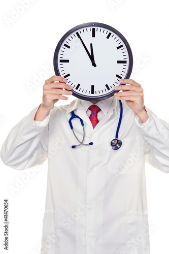 Photo: Arzt im Stress mit Uhr vor Kopf Arzt im Stress mit Uhr vor Kopf