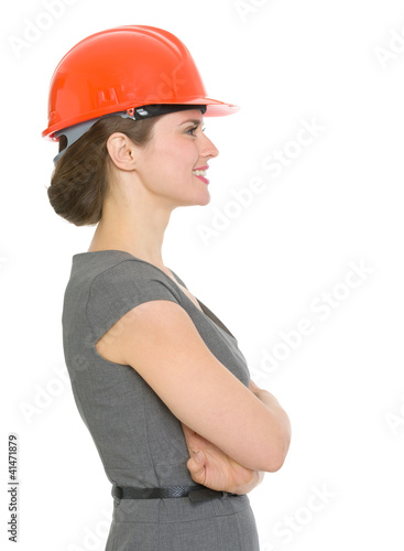 Photo: Modern architect woman looking sideways Modern architect woman looking sideways