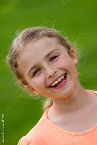Photo: Lovely little girl in the garden Lovely little girl in the garden