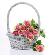 Photo: bouquet of pink roses in basket isolated on white background bouquet of pink roses in basket isolated on white background