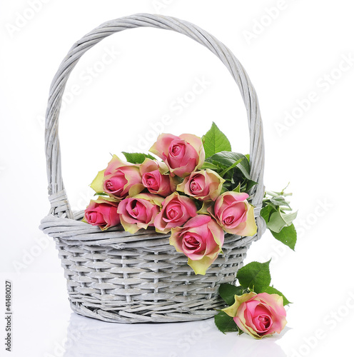 Photo: bouquet of pink roses in basket isolated on white background bouquet of pink roses in basket isolated on white background