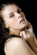 The wet girl with the spread cosmetics on the black