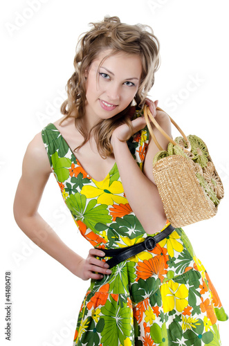 Photo: The beautiful girl in a summer dress isolated The beautiful girl in a summer dress isolated