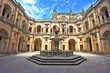 Photo: Beautifully preserved castle. In the center - a fountain Beautifully preserved castle. In the center - a fountain