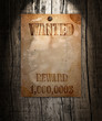 Vintage wanted poster on a wooden wall