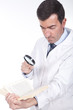 man holding a magnifying glass  and book