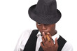 sexy black man wearing a hat and smoking a cigar sexy black man wearing a hat and smoking a cigar