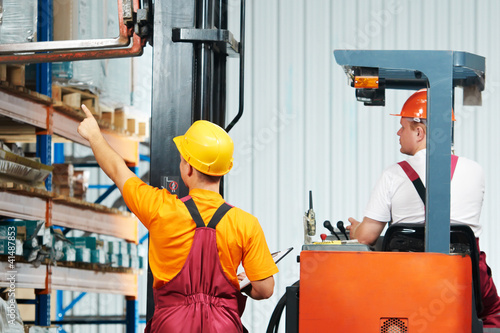 Photo: manual workers in warehouse manual workers in warehouse