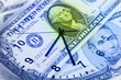 Clock and banknotes.