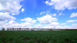 Video: Moving beautiful clouds over a green field Moving beautiful clouds over a green field
