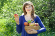 woman with apple harvest in orchard woman with apple harvest in orchard