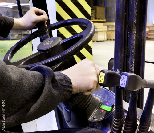 Photo: Worker driver of a forklift Worker driver of a forklift