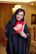 Arabian lady wearing hijab happy for receiving a gift