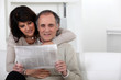Mature couple reading a newspaper Mature couple reading a newspaper
