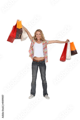 Photo: portrait of a woman with shopping bags portrait of a woman with shopping bags
