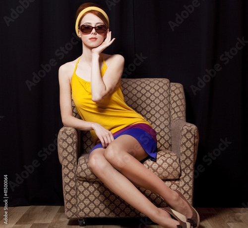 Photo: Redhead girl in armchair. 70s Redhead girl in armchair. 70s