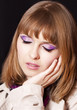 Portrait of beautiful redhead girl with style make-up.