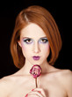 Portrait of beautiful redhead girl with style make-up.