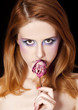 Portrait of beautiful redhead girl with style make-up.