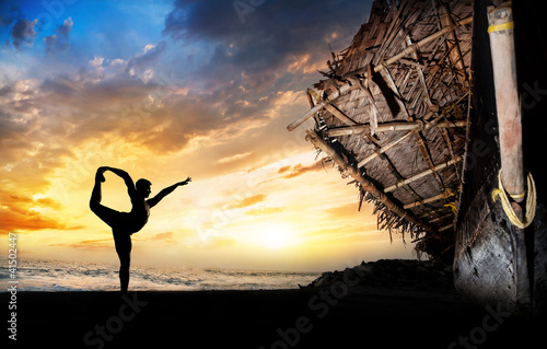 Photo: Man silhouette doing yoga Man silhouette doing yoga