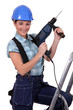 Tradeswoman holding a power tool