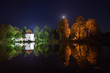 Church on the water at night in Zwierzyniec, Poland.