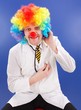 Clown doctor on blue with stethoscope