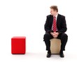 Businessman sitting lonely