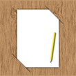The new paper and yellow pencil throw in wooden board. The new paper and yellow pencil throw in wooden board.
