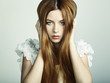 Fashion photo of a young woman with red hair