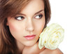 a young attractive girl with perfect makeup and a rose